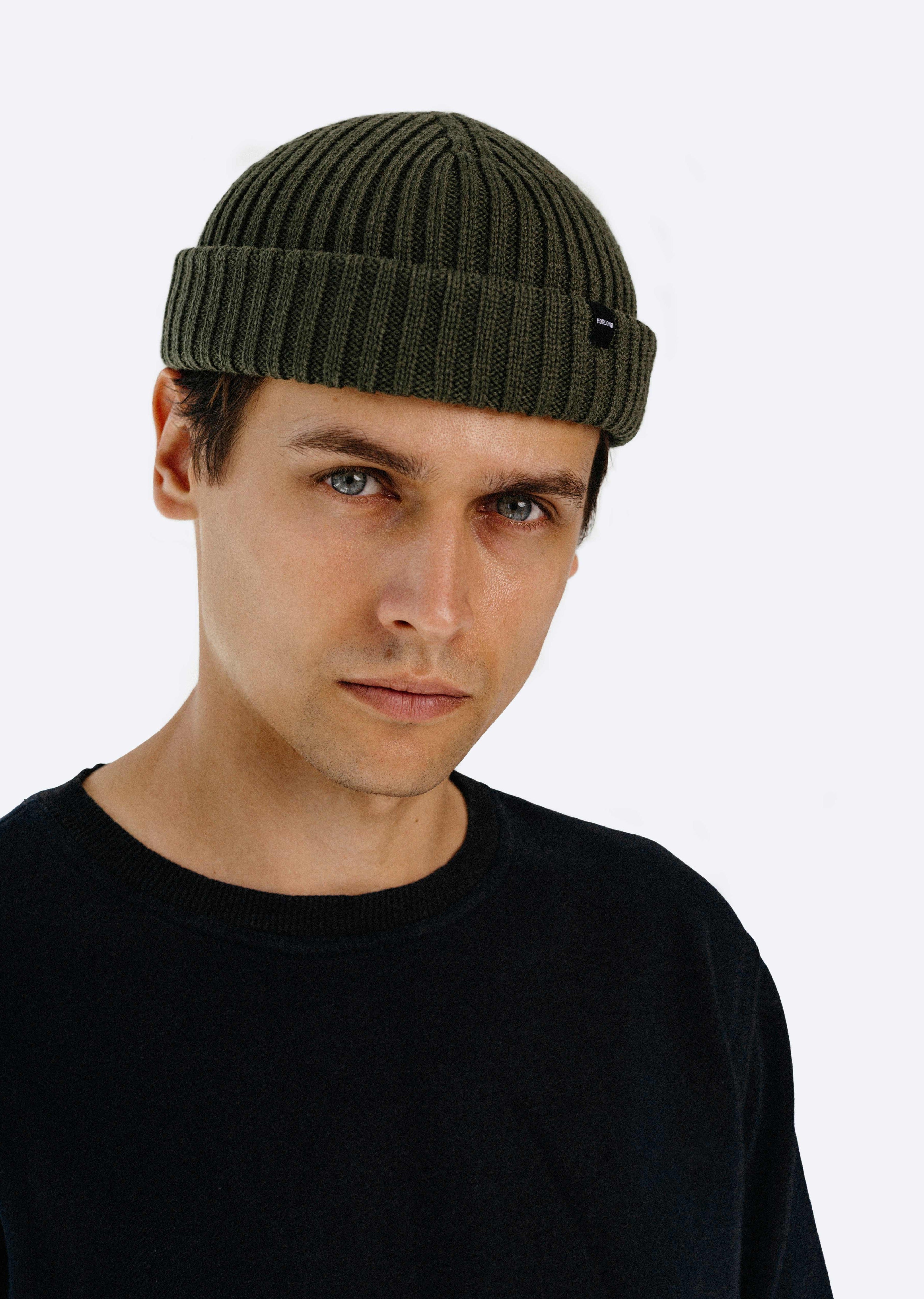 Man model wearing army green fisherman beanie