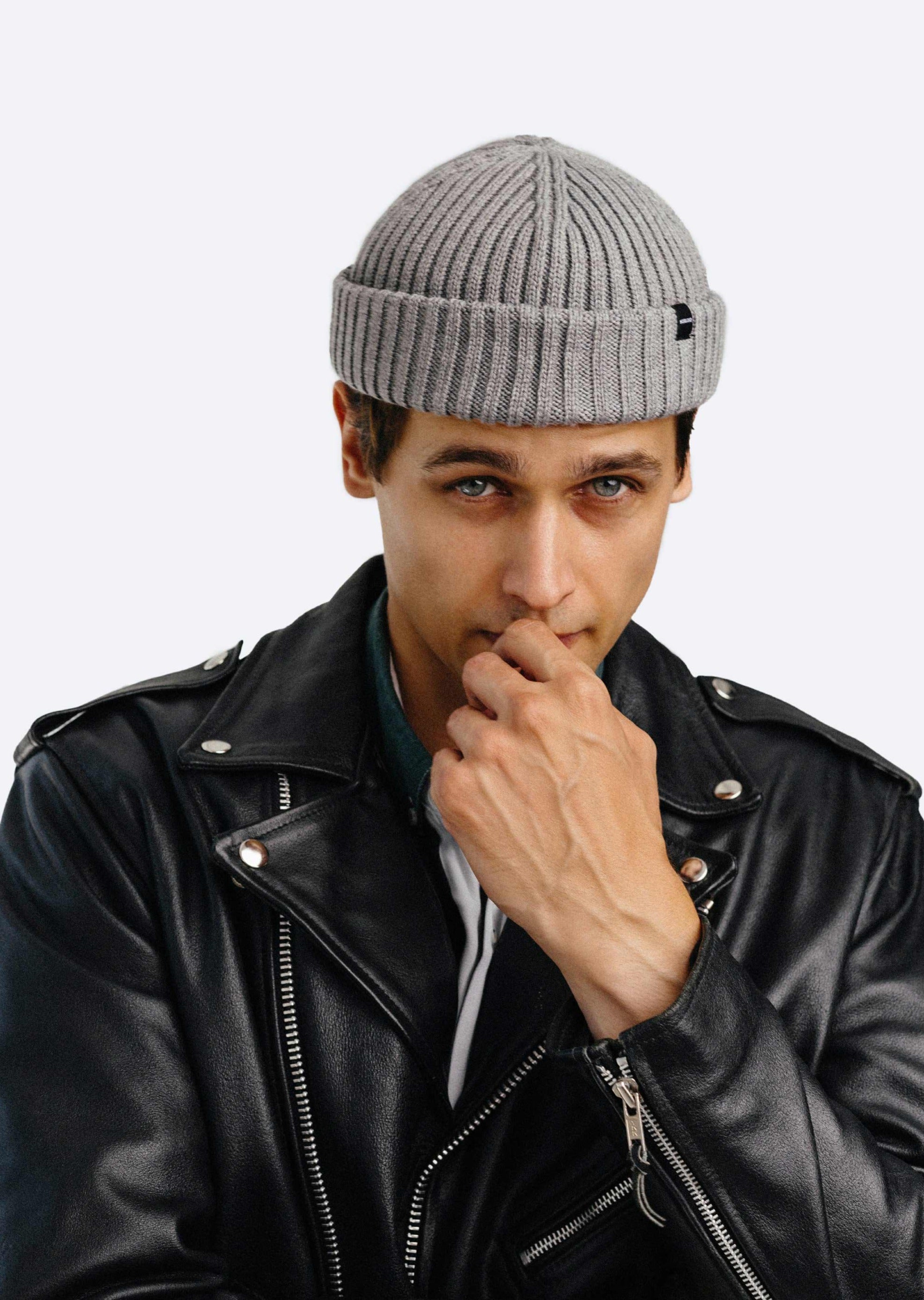 Model Male is wearing a gray fisherman beanie